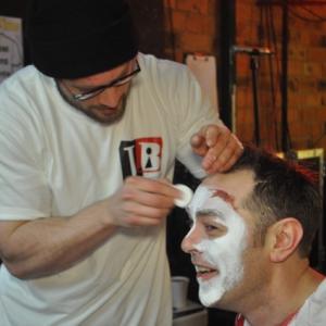 James JiB Brown applying makeup to an actor for Gangster Poker Face 2012