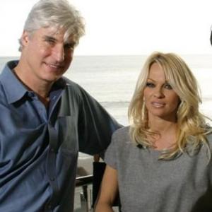 Blonde and Blonder production executive ERIC PARKINSON with PAMELA ANDERSON at Malibu Beach press junket for the film Jan 2008