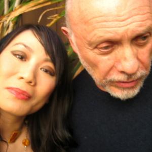 Linda Wang and Hector Elizondo posing for the Chinese associate news press article.