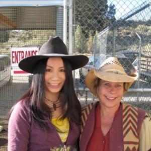 Linda Wang working with wild Bull trainer on Discovery channels hit show  Animal Planet
