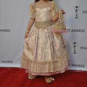 Caitlin Carmichael wearing Wanda Beauchamp dress and accessories on red carpet for Young Artist Awards March 2011