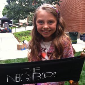 Caitlin Carmichael as Emma on The Neighbors 2012