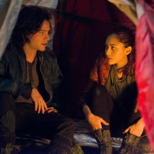 Still of Thomas McDonell and Lindsey Morgan in The 100 2014