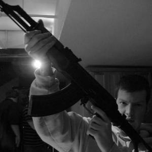 Holding a real AK47 on the set of Macs Apartment!