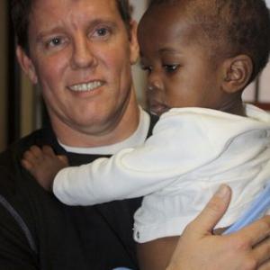 Lake Sherwood resident Chris Morrow with a child Benicio who was airlifted out of Haiti a few days ago and adopted by Morrows friend and business partner who lives in Visalia Calif