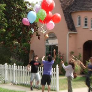 Behind the scenes on Up with the Pup as ballons get caught in tree with fake dog
