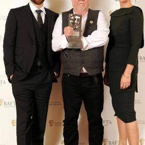 Richard Rankin and Neve McIntosh presenting the 2015 BAFTA Scotland award for Best Director to Donald Coutts for Katie Morag.