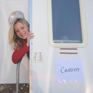 Saxon Sharbino as Chastity Storch's (Sheriff Storch, Andrew Howard)daughter