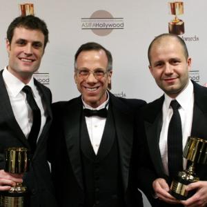Special achievement award winners Brian McLean and Martin Meunier surround presenter Frank Gladstone