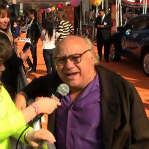 Piper interviewing Danny DeVito on the orange carpet at the premiere for The Lorax