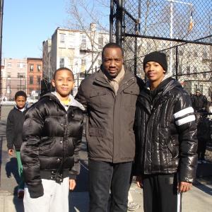 Germir RobinsonLeft Malik Yoba and Gerold Robinson Jrright on set of Person of Interest Episode 114 Wolf and Cub