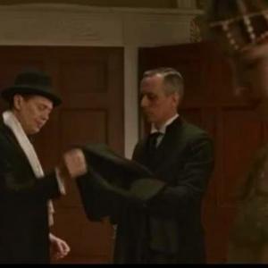 Handing Nucky Thompson (Steve Buscemi) his coat on the Season 3 premiere of Boardwalk Empire, Kelly Karavites, the new Thompson house butler.