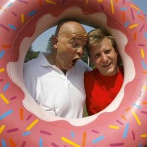 Tim Kavanagh, left, as Homer Simpson, and Brock Rutter as Bart Simpson, pose inside a fake doughnut in Springfield, Vt., Tuesday, June 19, 2007.