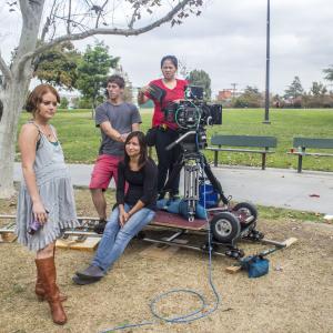 Director Sarah Phillips talks through a scene with Director of Photography Olivia Kuan and the crew