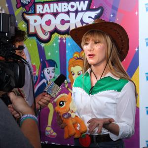 Tara-Nicole doing an interview on the red carpet at the My Little Pony: Rainbow Rocks Premiere.