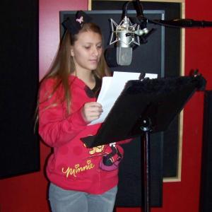 Tara Nicole at work in the voice over studio.