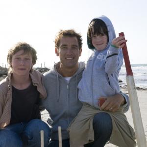 Still of Clive Owen George MacKay and Nicholas McAnulty in The Boys Are Back 2009