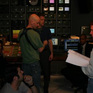 Associate Director Richard Lesko rightprepares for the control room scene with cast and crew