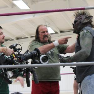 Behind the scenes on the movie Little Creeps seen here is director Brad Leo Lyon working with Jake the Snake Roberts during rehearsals