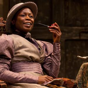 Prudence Zainab Jah enjoying a pipe and cup of tea at Chilfords house in the world premiere production of The Convert by Danai Gurira directed by Emily Mann
