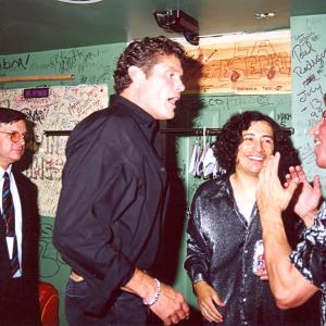 Kim Richards looks on as David Hasselhoff congratulates RENEGADEs Danny David Flores and Kenny Marquez backstage at The Conga Room moments after Hasselhoff presented the Richards produced group with platinum awards for sales in excess of 30 million worldwide