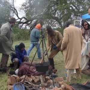 Cast and Crew members prepare for a scene during a cold day on set