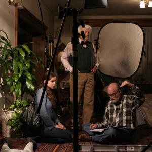 Director Hank Isaac discusses a scene with actors Tara Hanson and Stan Claussen