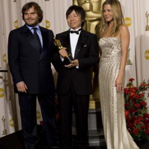 Academy Award®-winner Kunio Kato (center) with presenters (left to right) Jack Black and Jennifer Aniston backstage at the 81st Academy Awards® are presented live on the ABC Television network from The Kodak Theatre in Hollywood, CA, Sunday, February 22, 2009.