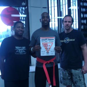 Me and Instructor Tony Hardy and Master Nathan Carlen, receiving my Orange Belt