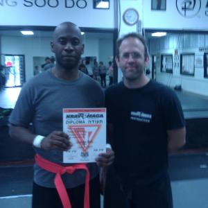 Me and Instructor Crhis Crouch receiving my Orange Belt