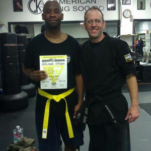 Torrey recieves his yellow belt in Krav Maga in March 2013 with his instrcutor Chris Crouch