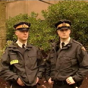 Constables Gunter Weissbock and L. Conlin hold the line as members of the Royal Canadian Mounted Police (RCMP), better known as 