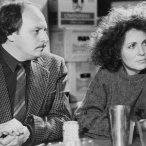 Still of Joanna Cassidy and Dennis Franz in The Package 1989