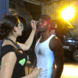 Roy getting a touchup on the set of The Breaking Point