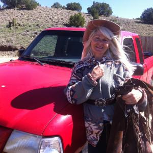 cowgirl with lil red truck