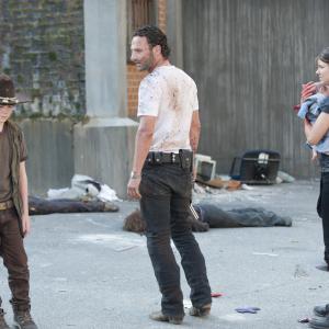Still of Andrew Lincoln, Lauren Cohan and Chandler Riggs in Vaiksciojantys negyveliai (2010)