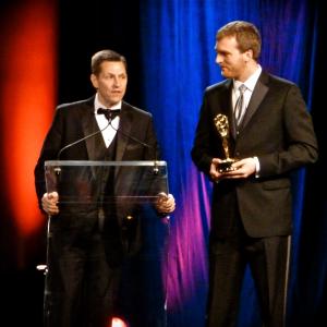 Michael Wickham right accepts the Emmy Award along with Rich Becker for their feature story The Color of Hope