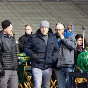 The brothers on the set of Woodlawn with football stunt coordinator Mark Ellis