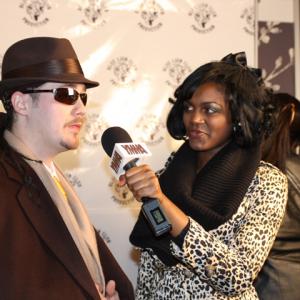 Che being interviewed on the red carpet at the Atlanta premiere of Breaking Up Is Hard To Do.