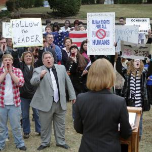 Congresswoman Sarah Thatcher September Carter addresses an angry mob of protesters and supporters in JamesWorks Entertainments FOLLOWED