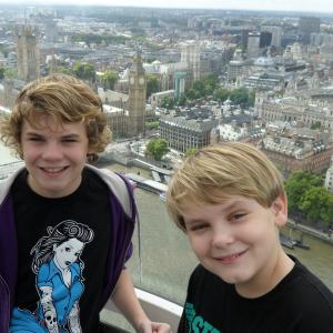 Ryan Hartwig and Reese Hartwig on the Eye of London with Big Ben in the background while on a break from shooting 