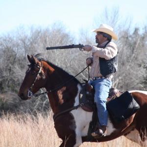 Mounted gun fight with his horse Ginger, feature film 