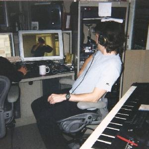 Composer Carter Burwell in New York City with engineer Dean Parker working on the score for Moving Gracefully Towards the Exit Patrice M Regnier is seen in the clip from the film on screen