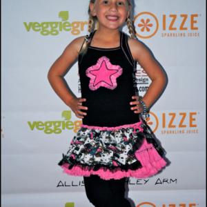 Natalia Stoa on the red carpet in Ooh! La,La! Couture at the Allisyn Ashley Arm Art Exhibition.