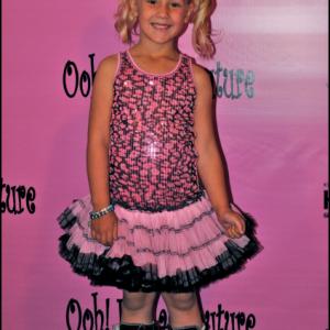 Natalia Stoa walking the pink carpet in Ooh! LaLa! Couture at the 3rd Annual Tutus 4 Tots!