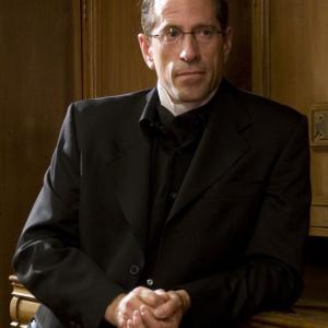 Montgomery Paulsen as The Choir Director in Contractor's Routine