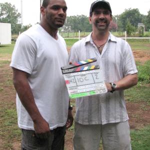 Jose presents director Victor Hobson with the slate from Soul Ties.