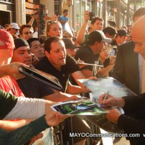 Green Lanter Director Martin Campbell signs scores of autographs for fans before walking the celebrity carpet with Actress Sol Romero wife Ryan Reynolds and Angela Bassett also did the same at the star studded Warner Bros event See slide show  wwwM