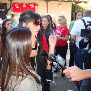 Reality TV Shows Kim Kardashian Disney Channel star and Adrienne Bailon talk to ABC ch 7 about Celebrity Shoe Toss where donated shoes went to needy families in LA