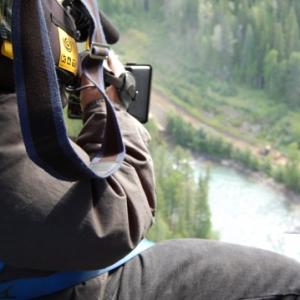 Sergio Olivares shooting Canadian Rocky Mountains from helicopter